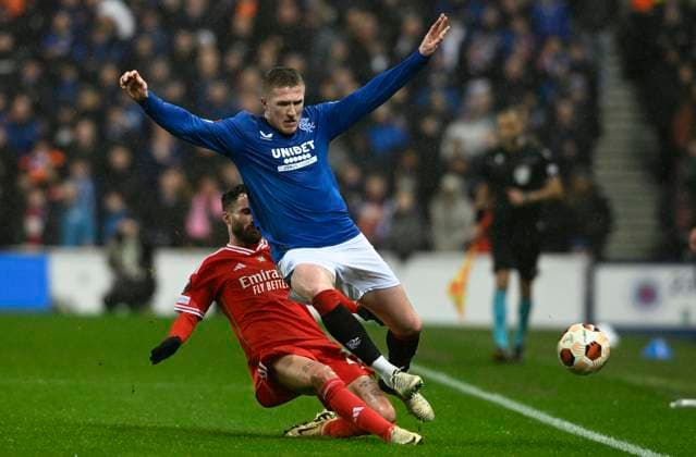 Glasgow, Scotland, 14th March 2024. Rafa Silva of Benfica and John Lundstram of Rangers during the UEFA Europa League Round of 16 match at Ibrox Stadium, Glasgow. Picture credit should read: Neil Hanna Sportimage EDITORIAL USE ONLY. No use with unauthorised audio, video, data, fixture lists, club league logos or live services. Online in-match use limited to 120 images, no video emulation. No use in betting, games or single club league player publications. SPI-3007-0002