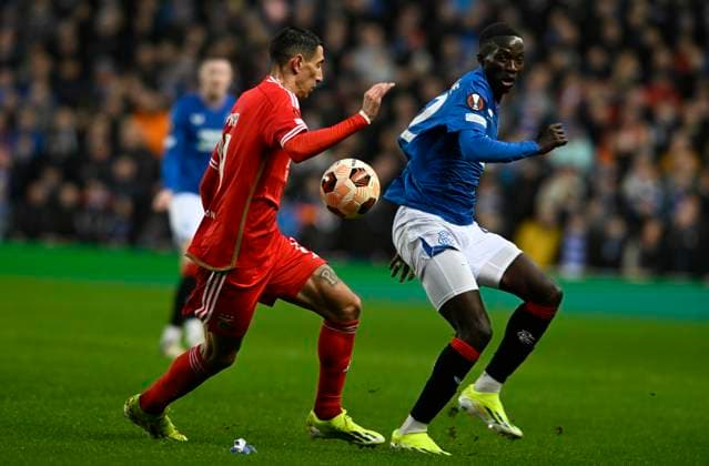 Glasgow, Scotland, 14th March 2024. çngel Di Mar’a of Benfica and Mohamed Diomande of Rangers during the UEFA Europa League Round of 16 match at Ibrox Stadium, Glasgow. Picture credit should read: Neil Hanna Sportimage EDITORIAL USE ONLY. No use with unauthorised audio, video, data, fixture lists, club league logos or live services. Online in-match use limited to 120 images, no video emulation. No use in betting, games or single club league player publications. SPI-3007-0003