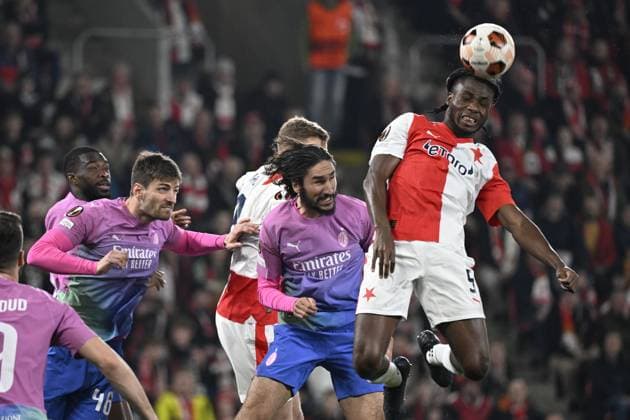Igoh Ogbu of Slavia, right, in action during the Slavia Praha vs AC Milan football return match of the Europa League semi-final on March 14, 2024, Prague, Czech Republic. (CTKxPhoto KaterinaxSulova) CTKPhotoP2024031407139  CTKPhotoP2024031407139