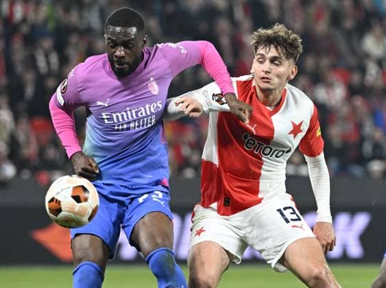 Fikayo Tomori of AC Milan, left, and Mojmir Chytil of AC Milan in action during the Slavia Praha vs AC Milan football return match of the Europa League semi-final on March 14, 2024, Prague, Czech Republic. (CTKxPhoto KaterinaxSulova) CTKPhotoP2024031407571  CTKPhotoP2024031407571