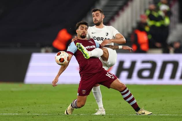 14th March 2024; London Stadium, London, England; Europa League Football, Round of 16, Second Leg, West Ham United versus SC Freiburg; Manuel Gulde of SC Freiburg competes for the ball with Lucas Paqueta of West Ham United  ActionPlus12617898 ShaunxBrooks