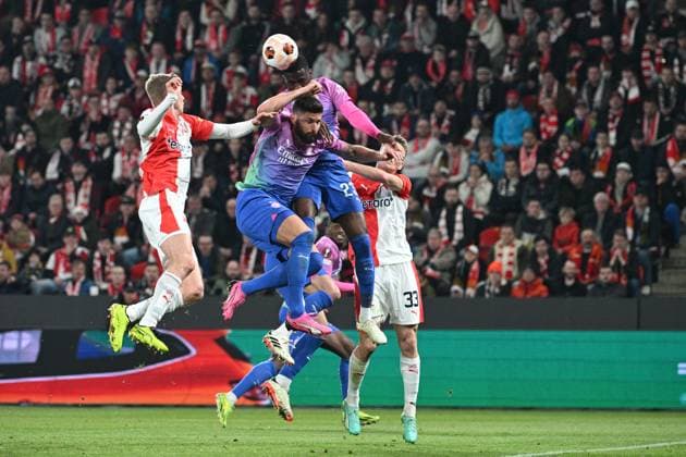 (L-R) Olivier Giroud and Fikayo Tomori of AC Milan and Ondrej Zmrzly of Slavia Praha in action during the Slavia Praha vs AC Milan football return match of the Europa League semi-final on March 14, 2024, Prague, Czech Republic. (CTKxPhoto MichalxKamaryt) CTKPhotoP2024031407741  CTKPhotoP2024031407741