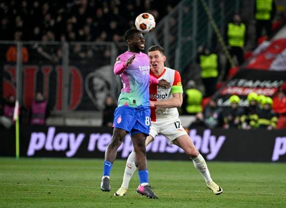 Yunus Musah of AC Milan, left, and Lukas Provod of Slavia Praha in action during the Slavia Praha vs AC Milan football return match of the Europa League semi-final on March 14, 2024, Prague, Czech Republic. (CTKxPhoto KaterinaxSulova) CTKPhotoP2024031407782  CTKPhotoP2024031407782