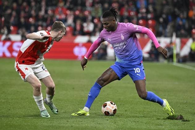David Doudera of Slavia Praha, left, and Rafael Leao of AC Milan in action during the Slavia Praha vs AC Milan football return match of the Europa League semi-final on March 14, 2024, Prague, Czech Republic. (CTKxPhoto KaterinaxSulova) CTKPhotoP2024031407823  CTKPhotoP2024031407823