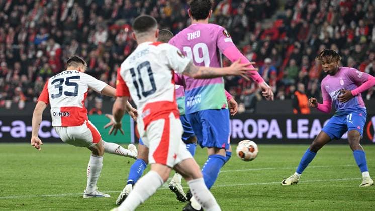 Matej Jurasek of Slavia Praha, left, shots a goal during the Slavia Praha vs AC Milan football return match of the Europa League semi-final on March 14, 2024, Prague, Czech Republic. (CTKxPhoto MichalxKamaryt) CTKPhotoP2024031408253  CTKPhotoP2024031408253