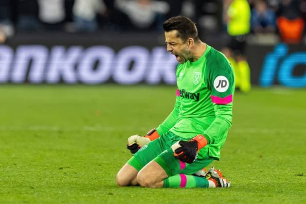 Football - 2023 2024 UEFA Europa League - West Ham United vs Freiburg - Round of Sixteen - Second Leg - London Stadium - Thursday 14th March 2024 Lukasz Fabianski (West Ham United) sinks to his knees in celebration after Mohammed Kudus (West Ham United) scores his teams fourth goal at The London Stadium COLORSPORT DANIEL BEARHAM  csp_whu_fre_db_14032024_