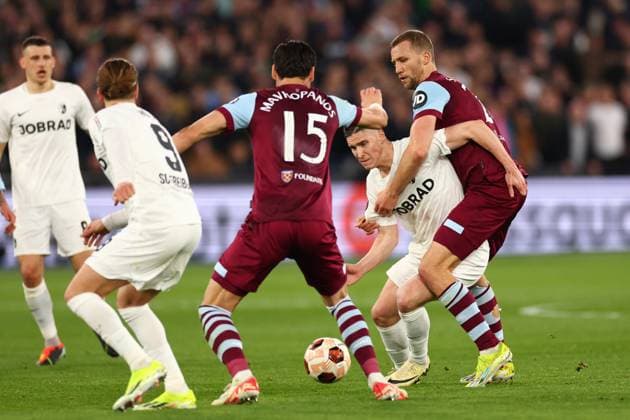 14th March 2024; London Stadium, London, England; Europa League Football, Round of 16, Second Leg, West Ham United versus SC Freiburg; Roland Sallai of SC Freiburg competes for the ball with Tomas Soucek of West Ham United  ActionPlus12617977 ShaunxBrooks