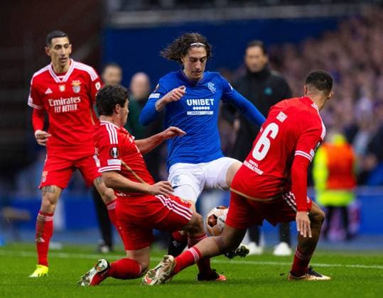 Rangers Forward Fabio Silva in action with Joao Neves of Benfica during UEFA Europa League Round of 16 Second Leg match at Ibrox. Rangers v Benfica, UEFA Europa League, Round of 16, Second Leg, Football, Ibrox Stadium, Glasgow, UK - 14 Mar 2024 EDITORIAL USE ONLY No use with unauthorised audio, video, data, fixture lists, club league logos or live services. Online in-match use limited to 120 images, no video emulation. No use in betting, games or single club league player publications. Copyright: xLukexNickerson RangersxFC Shutterstockx 14389051ag