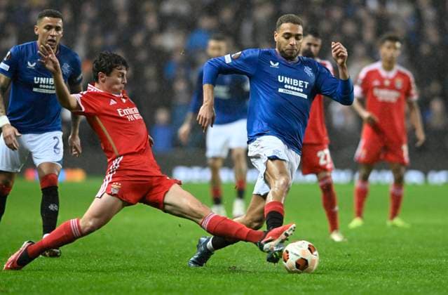 Glasgow, Scotland, 14th March 2024. Jo‹o Neves of Benfica and Cyriel Dessers of Rangers during the UEFA Europa League Round of 16 match at Ibrox Stadium, Glasgow. Picture credit should read: Neil Hanna Sportimage EDITORIAL USE ONLY. No use with unauthorised audio, video, data, fixture lists, club league logos or live services. Online in-match use limited to 120 images, no video emulation. No use in betting, games or single club league player publications. SPI-3007-0016