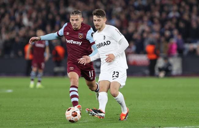 . - West Ham United v SC Freiburg, UEFA Europa League, Round Of 16, 2nd Leg, London Stadium, London, UK - 14th March 2024. Florent Muslija of SC Freiburg battles Kalvin Phillips of West Ham United. - West Ham United v SC Freiburg, UEFA Europa League, Round Of 16, 2nd Leg, London Stadium, London, UK - 14th March 2024. London London Stadium UK Copyright: xDanxWeirx CP_West_Ham_SC_Freiburg_20