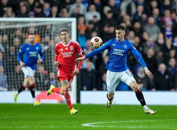 Tom Lawrence of Rangers chased by Angel Di Maria of Benfica. Rangers v Benfica, UEFA Europa League, Round of 16, Second Leg, Football, Ibrox Stadium, Glasgow, UK - 14 Mar 2024 EDITORIAL USE ONLY No use with unauthorised audio, video, data, fixture lists, club league logos or live services. Online in-match use limited to 120 images, no video emulation. No use in betting, games or single club league player publications. Copyright: xStuartxWallace Shutterstockx 14385550r