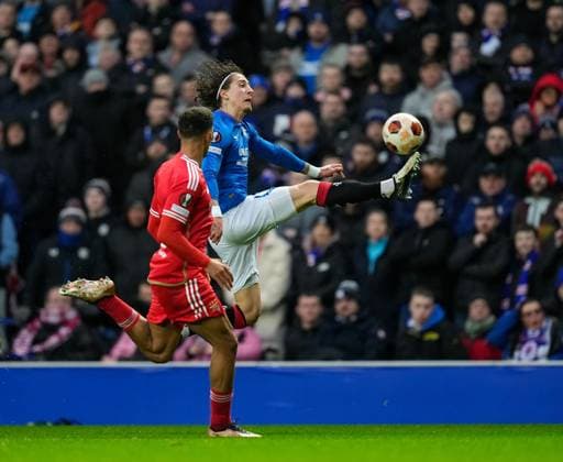 Fabio Silva of Rangers controls the ball under pressure from Alexander Bah of Benfica. Rangers v Benfica, UEFA Europa League, Round of 16, Second Leg, Football, Ibrox Stadium, Glasgow, UK - 14 Mar 2024 EDITORIAL USE ONLY No use with unauthorised audio, video, data, fixture lists, club league logos or live services. Online in-match use limited to 120 images, no video emulation. No use in betting, games or single club league player publications. Copyright: xStuartxWallace Shutterstockx 14385550w