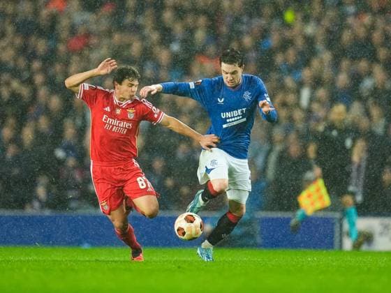 Joao Neves of Benfica & Scott Wright of Rangers challenge for the ball. Rangers v Benfica, UEFA Europa League, Round of 16, Second Leg, Football, Ibrox Stadium, Glasgow, UK - 14 Mar 2024 EDITORIAL USE ONLY No use with unauthorised audio, video, data, fixture lists, club league logos or live services. Online in-match use limited to 120 images, no video emulation. No use in betting, games or single club league player publications. Copyright: xStuartxWallace Shutterstockx 14385550ae