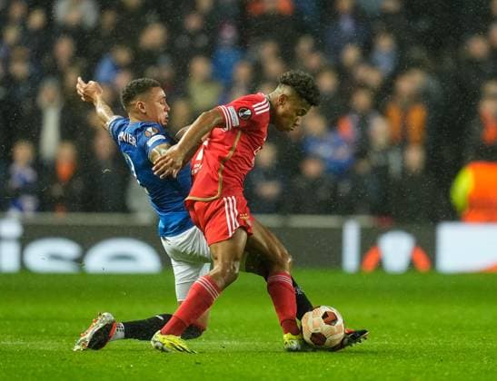 Rangers Captain James Tavernier tackles David Neres of Benfica. Rangers v Benfica, UEFA Europa League, Round of 16, Second Leg, Football, Ibrox Stadium, Glasgow, UK - 14 Mar 2024 EDITORIAL USE ONLY No use with unauthorised audio, video, data, fixture lists, club league logos or live services. Online in-match use limited to 120 images, no video emulation. No use in betting, games or single club league player publications. Copyright: xStuartxWallace Shutterstockx 14385550ai