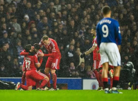 Rafa of Benfica celebrates with team mates after the goal he scored to give Benfica a 0-1 lead (Agg. 2-3) was allowed following a VAR check for possible offside. Rangers v Benfica, UEFA Europa League, Round of 16, Second Leg, Football, Ibrox Stadium, Glasgow, UK - 14 Mar 2024 EDITORIAL USE ONLY No use with unauthorised audio, video, data, fixture lists, club league logos or live services. Online in-match use limited to 120 images, no video emulation. No use in betting, games or single club league player publications. Copyright: xStuartxWallace Shutterstockx 14385550ar