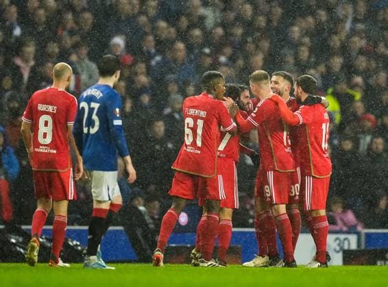 Rafa of Benfica celebrates with team mates after the goal he scored to give Benfica a 0-1 lead (Agg. 2-3) was allowed following a VAR check for possible offside. Rangers v Benfica, UEFA Europa League, Round of 16, Second Leg, Football, Ibrox Stadium, Glasgow, UK - 14 Mar 2024 EDITORIAL USE ONLY No use with unauthorised audio, video, data, fixture lists, club league logos or live services. Online in-match use limited to 120 images, no video emulation. No use in betting, games or single club league player publications. Copyright: xStuartxWallace Shutterstockx 14385550ay