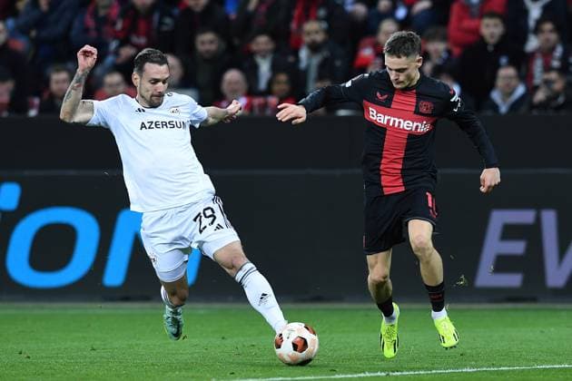Soccer Europa League Round of 16 Bayer 04 Leverkusen Qarabag Agdam on 14 03 2024 at the BayArena in Leverkusen Marko Vesovic Agdam , left Florian Wirtz Leverkusen , right xRx