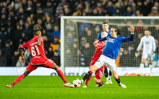 Florentino of Benfica & Fabio Silva of Rangers challenge for the ball. Rangers v Benfica, UEFA Europa League, Round of 16, Second Leg, Football, Ibrox Stadium, Glasgow, UK - 14 Mar 2024 EDITORIAL USE ONLY No use with unauthorised audio, video, data, fixture lists, club league logos or live services. Online in-match use limited to 120 images, no video emulation. No use in betting, games or single club league player publications. Copyright: xStuartxWallace Shutterstockx 14385550be