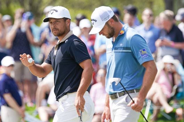 March 14, 2024, Ponte Vedra Beach, Florida, United States: Xander Schauffele (L) and Sam Burns walk off the 9th green during the first round of the 2024 PLAYERS Championship at TPC Sawgrass. Ponte Vedra Beach United States - ZUMAw109 20240314_fap_w109_013 Copyright: xDebbyxWongx