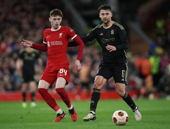 Liverpool FC v AC Sparta Praha: Round of 16 Second Leg - UEFA Europa League 2023 24 Conor Bradley of Liverpool and Kaan Kairinen of Sparta Prague challenge during the UEFA Europa League 2023 24 round of 16 second leg match between Liverpool FC and AC Sparta Praha at Anfield on March 14, 2024 in Liverpool, England. Liverpool Anfield England United Kingdom Copyright: xSportsphoto Sportsphoto APLx 13969536