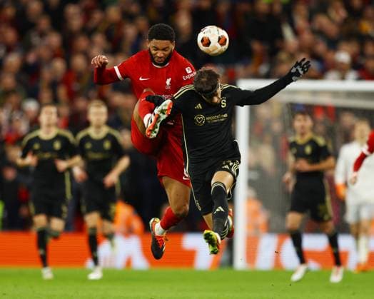 Liverpool, England, 14th March 2024. Joe Gomez of Liverpool and Veljko BirmanÄeviÄ‡ of Sparta Prague during the UEFA Europa League Round of 16 match at Anfield, Liverpool. Picture credit should read: Gary Oakley Sportimage EDITORIAL USE ONLY. No use with unauthorised audio, video, data, fixture lists, club league logos or live services. Online in-match use limited to 120 images, no video emulation. No use in betting, games or single club league player publications. SPI-3009-0025
