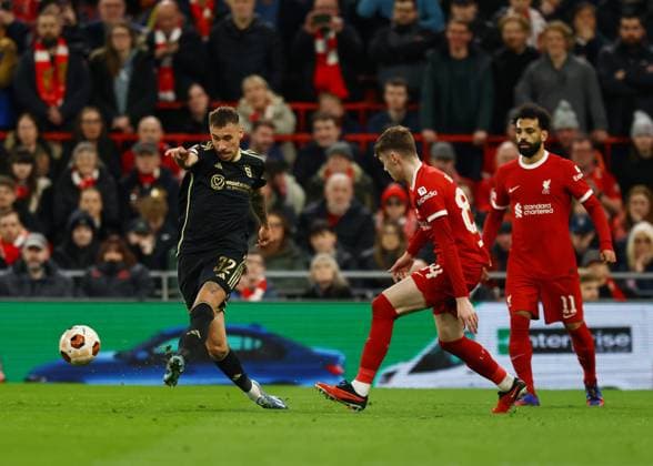Liverpool, England, 14th March 2024. MatÄ›j RyneÅ¡ of Sparta Prague passes the ball during the UEFA Europa League Round of 16 match at Anfield, Liverpool. Picture credit should read: Gary Oakley Sportimage EDITORIAL USE ONLY. No use with unauthorised audio, video, data, fixture lists, club league logos or live services. Online in-match use limited to 120 images, no video emulation. No use in betting, games or single club league player publications. SPI-3009-0041