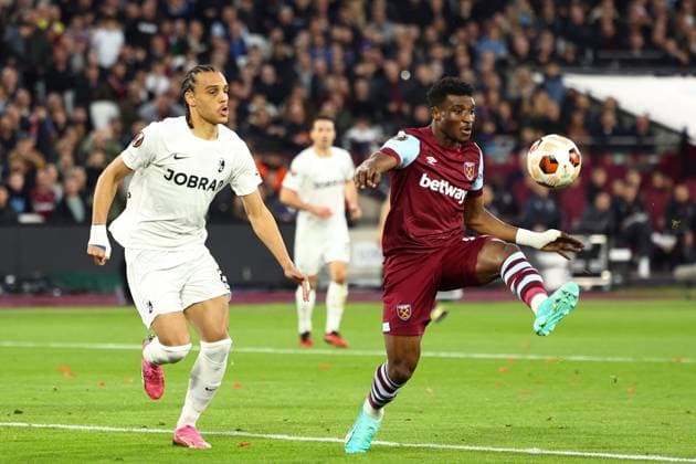 Mohammed Kudus of West Ham United under pressure from Kiliann Sildillia of SC Freiburg West Ham United v Freiburg, UEFA Europa League, Round of 16, Second Leg, Football, London Stadium, London, UK - 14 Mar 2024 EDITORIAL USE ONLY No use with unauthorised audio, video, data, fixture lists, club league logos or live services. Online in-match use limited to 120 images, no video emulation. No use in betting, games or single club league player publications. Copyright: xSimonxDael Shutterstockx 14385551cb