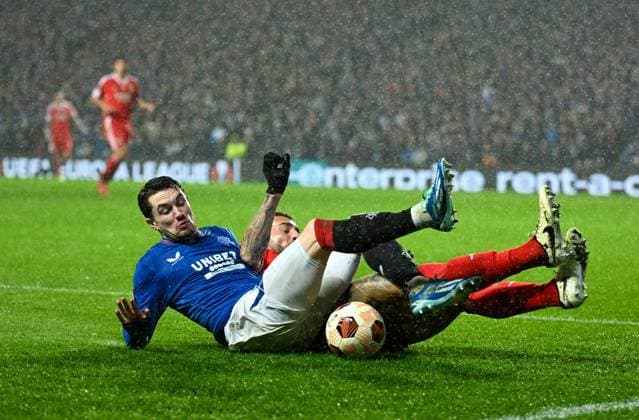 Glasgow, Scotland, 14th March 2024. Scott Wright of Rangers and Nicol‡s Otamendi of Benfica during the UEFA Europa League Round of 16 match at Ibrox Stadium, Glasgow. Picture credit should read: Neil Hanna Sportimage EDITORIAL USE ONLY. No use with unauthorised audio, video, data, fixture lists, club league logos or live services. Online in-match use limited to 120 images, no video emulation. No use in betting, games or single club league player publications. SPI-3007-0096