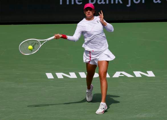 March 14, 2024 Iga Swiatek of Poland returns a shot against Caroline Wozniacki of Denmark during the BNP Paribas Open in Indian Wells, CA. CSM Indian Wells United States of America - ZUMAc04_ 20240314_zma_c04_230 Copyright: xCharlesxBausx