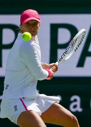 March 14, 2024 Iga Swiatek of Poland returns a shot against Caroline Wozniacki of Denmark during the BNP Paribas Open in Indian Wells, CA. CSM Indian Wells United States of America - ZUMAc04_ 20240314_zma_c04_254 Copyright: xCharlesxBausx