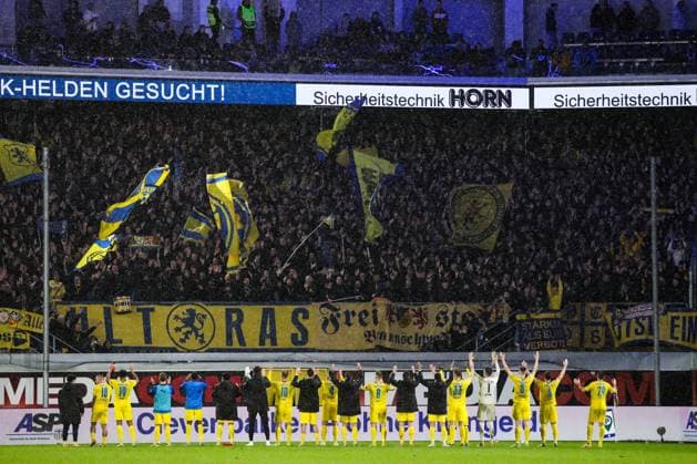 The Eintracht Braunschweig team celebrates the victory in front of the fan block after the end of the match 2 Soccer Bundesliga season 2023 2024 SC Paderborn vs Eintracht Braunschweig at the Home Deluxe Arena in Paderborn Action,Soccer,Man,Men,Germany,15 03 2024