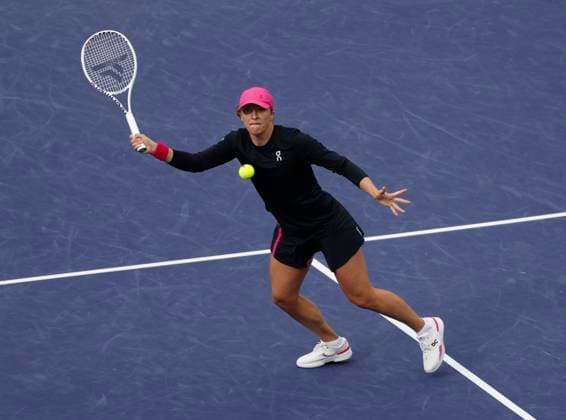 March 15, 2024 Iga Swiatek of Poland returns a shot against Marta Kostyuk of the Ukraine in their Semifinal match during the BNP Paribas Open in Indian Wells, CA. CSM Indian Wells United States of America - ZUMAc04_ 20240315_zma_c04_194 Copyright: xCharlesxBausx