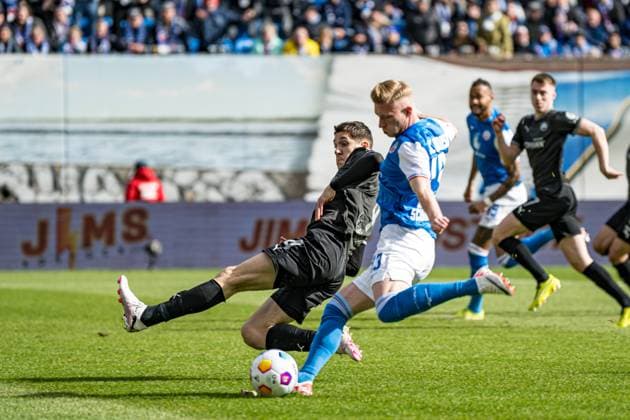 Rostock, Germany March 16, 2024 2 BL 2023 2024 FC Hansa Rostock vs Greuther Fürth In the picture from left in a duel Damian Michalski SpVgg Greuther Fürth and Kevin Schumacher Hansa Rostock DFL regulations prohibit any use of photographs as image sequences and or quasi video Copyright: xFotostandx xVoelkerx