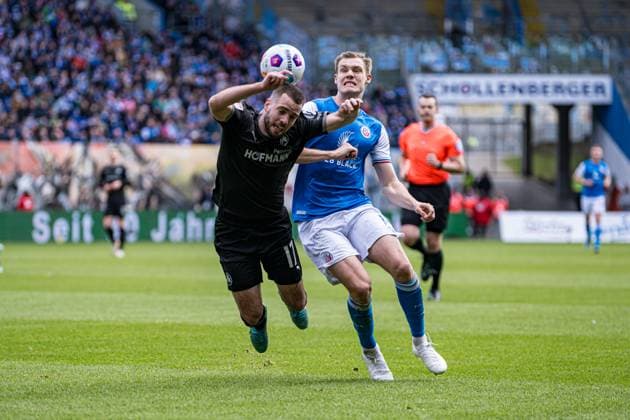 Rostock, Germany March 16, 2024 2 BL 2023 2024 FC Hansa Rostock vs Greuther Fürth In the picture from left in a duel Niko Gießelmann SpVgg Greuther Fürth and Svante Ingelsson Hansa Rostock DFL regulations prohibit any use of photographs as image sequences and or quasi video Copyright: xFotostandx xVoelkerx