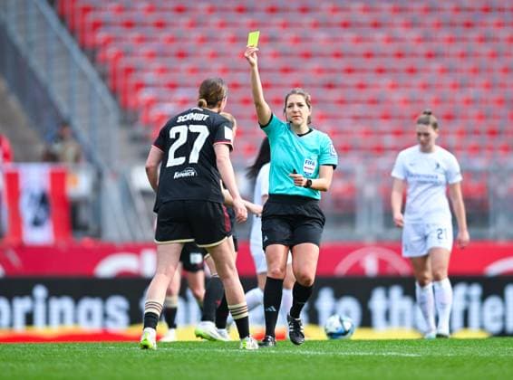 Germany, Nuremberg, 17 03 2024, Max Morlock Stadion, 1 FC Nuremberg vs SC Freiburg Frauen Bundesliga, Referee Karoline Wacker shows Lara Schmidt 1 FC Nuremberg the yellow card Nuremberg Max Morlock Stadion Bavaria Germany eu-images-738