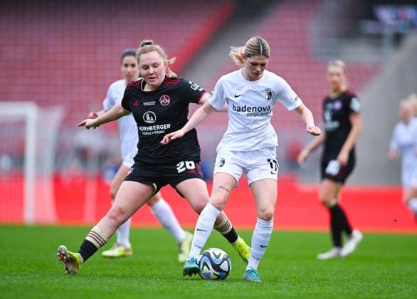Germany, Nuremberg, 17 03 2024, Max Morlock Stadion, 1 FC Nuremberg vs SC Freiburg Frauen Bundesliga, Eileen Campbell SC Freiburg and Madeleine Steck 1 FC Nuremberg battle for the ball Nuremberg Max Morlock Stadion Bavaria Germany eu-images-738