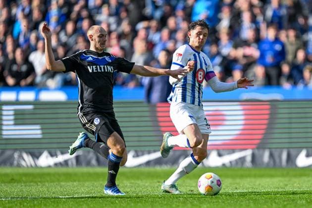 2 Bundesliga Hertha BSC Berlin FC Schalke 04 on 17 03 2024 at Olympiastadion in Berlin Henning Matriciani FC Schalke 04 in a tackle against Fabian Reese Hertha BSC Berlin MT