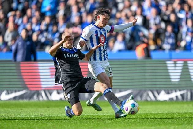 2 Bundesliga Hertha BSC Berlin FC Schalke 04 on 17 03 2024 at Olympiastadion in Berlin Henning Matriciani FC Schalke 04 in a tackle against Fabian Reese Hertha BSC Berlin MT
