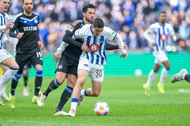 2 Bundesliga Hertha BSC Berlin FC Schalke 04 on 17 03 2024 at Olympiastadion in Berlin Ibrahim Maza Hertha BSC Berlin in a tackle against Danny Latza FC Schalke 04 MT