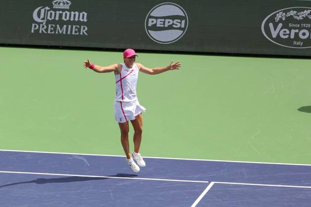 INDIAN WELLS, CA - MARCH 17: Iga Swiatek (POL) celebrates after winning the womenÕs singles final during the BNP Paribas Open on March 17, 2024 at Indian Wells Tennis Garden in Indian Wells, CA. (Photo by George Walker Icon Sportswire) TENNIS: MAR 17 BNP Paribas Open EDITORIAL USE ONLY Icon240317002