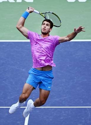 INDIAN WELLS, CA - MARCH 17: Carlos Alcaraz (ESP) leaping for the ball during an ATP, Tennis Herren finals tennis match played on March 17, 2024 during the BNP Paribas Open tennis tournament played at the Indian Wells Tennis Garden in Indian Wells, CA. (Photo by John Cordes Icon Sportswire) TENNIS: MAR 17 BNP Paribas Open EDITORIAL USE ONLY Icon506240317118