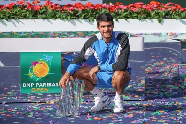 INDIAN WELLS, CA - MARCH 17: Carlos Alcaraz (ESP) poses with the trophy after winning the menÕs singles final of the BNP Paribas Open on March 17, 2024 at Indian Wells Tennis Garden in Indian Wells, CA. (Photo by George Walker Icon Sportswire) TENNIS: MAR 17 BNP Paribas Open EDITORIAL USE ONLY Icon240317067