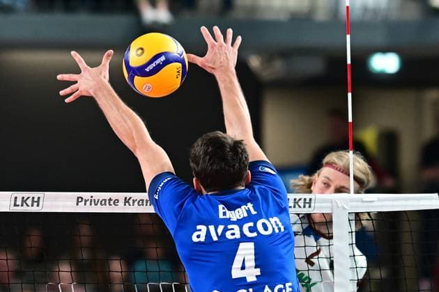 Volleyball I Men I 2023 2024 I Bundesliga I Playoffs I Quarterfinals I Game 2 I SVG Lüneburg WWK Volleys Herrsching I 23 3 2024 Here Daniel Gruvaeus 2, WWK Volleys Herrsching beats Wassenaar Ketrzynski 11, SVG Lüneburg Lüneburg LKH Arena Niedersachsen Germany through Xander Wolfs block Copyright: xLobeca AndreasxHannigx