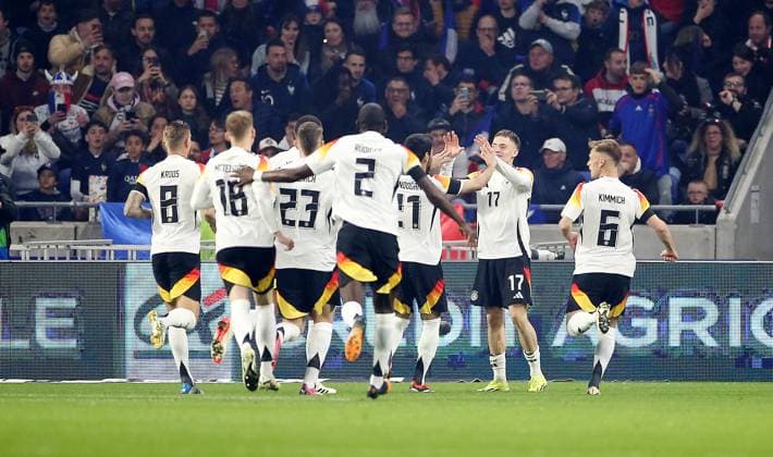 Lyon , international soccer match France vs. Germany , Germany cheering after the goal to 0 1 According to the regulations of the DFB German Football Association, it is prohibited to use or have used photographs taken in the stadium and or of the match in the form of sequential images and or video-like photo series