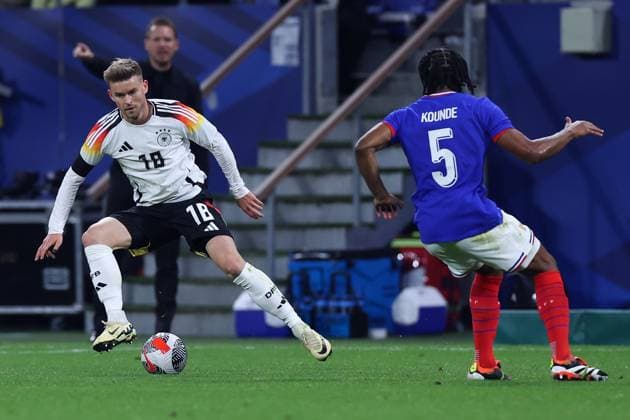 International soccer match France Germany on 23 03 2024 at Groupama Stadium in Lyon Maximilian Mittelstädt Germany , left Jules Kounde France , right DFB regulations prohibit any use of photographs as image sequences and or quasi video xMSx