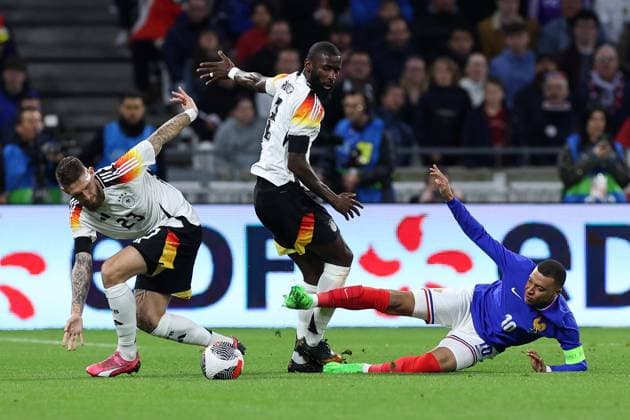 International soccer match France Germany on 23 03 2024 at Groupama Stadium in Lyon Robert Andrich Germany , left Antonio Rüdiger Germany , center Kylian Mbappe France , right DFB regulations prohibit any use of photographs as image sequences and or quasi video xMSx