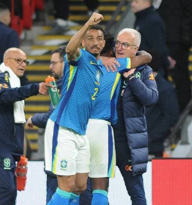 Football - 2024 International Friendly, Länderspiel, Nationalmannschaft - England vs Brazil - Wembley Stadium - Saturday 23rd March 2024 Endrick of Brazil celebrates scoring the only goal of the match with Manager, Silvestre Dorival Junior and Danilo COLORSPORT Andrew Cowie 