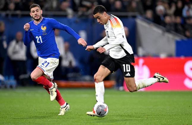 FOOTBALL INTERNATIONAL Test match in Lyon France Germany 23 03 2023 Lucas Hernandez left, France v Jamal Musiala right, Germany