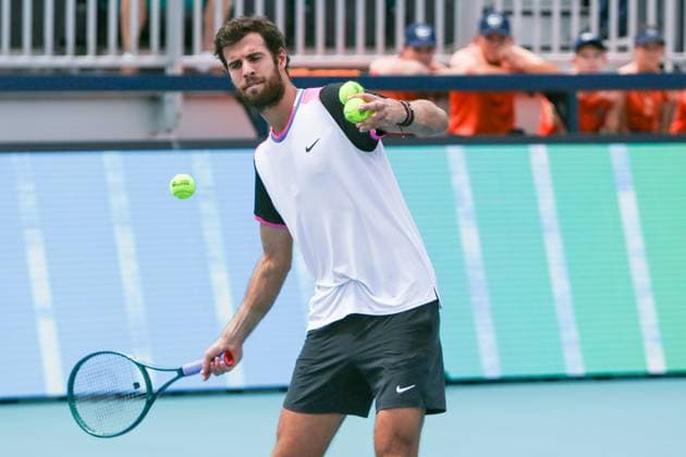 March 25, 2024, Miami Gardens, Florida, USA: Karen Khachanov hits tennis balls to the gallery after winning his third round of men s singles at the 2024 Miami Open presented by Itau at Hard Rock Stadium. Miami Gardens USA - ZUMAw109 20240325_fap_w109_004 Copyright: xDebbyxWongx