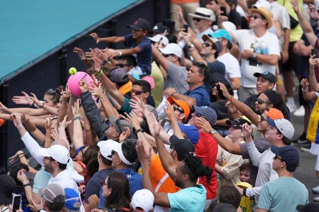 March 26, 2024, Miami, Florida, USA: Fans reach for an autograph ball signed by Carlos Alcaraz (Spain) and tossed to the crowd after practicing for his fourth round of menÃ¢â‚¬â ¢s singles at the Miami Open tennis tournament. Miami USA - ZUMAd212 20240326_zsp_d212_038 Copyright: xRichardxDolex
